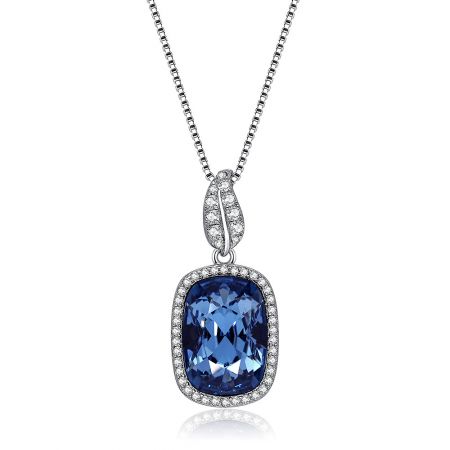 Close-up view of the blue Swarovski crystal pendant on the sterling silver necklace.