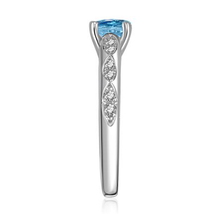 Detailed view of the Aquamarine Rider Ring's blue gemstone and diamond accents.