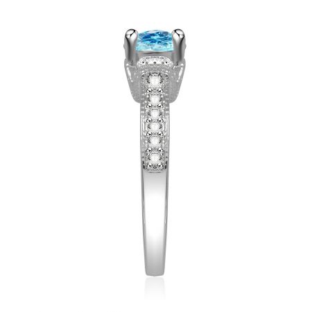 Close-up detail of the aquamarine elegant engagement ring, highlighting the large blue gemstone and decorative band.
