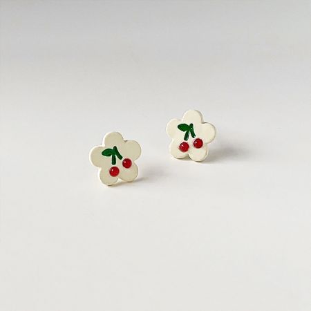 Full set of the flower-shaped earrings with cherry designs against a white background.