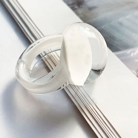 Two clear glass dome rings showcasing their transparent quality.