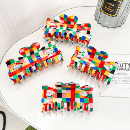 Plastic Colorful Retro Rainbow Chessboard Style Hair Claw Clips - A set of five colorful retro chessboard style hair claw clips with a unique bow design, displayed on a clean white surface.
