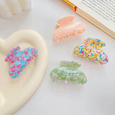 A beautiful collection of colorful butterfly-shaped hair clips.