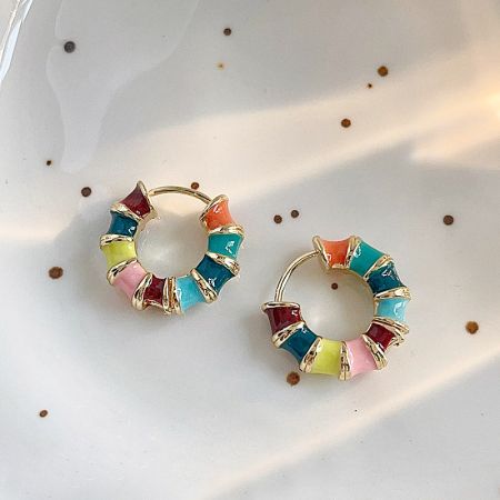 Front view of the vibrant enamel earrings with a polished gold base.
