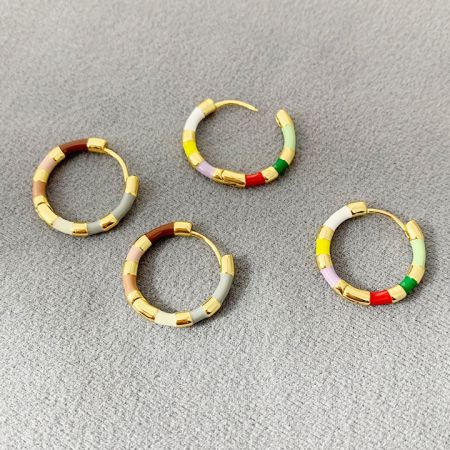 Four pairs of colorful gold hoop earrings showcasing different vibrant enamel color combinations.