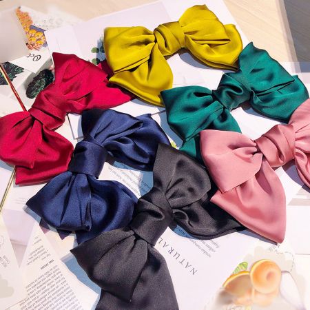 Sweet & Cute Large Bow Fabric Hair Clips - A vibrant collection of sweet and cute large fabric hair bows in multiple colors, displayed neatly for wholesale by JR Fashion Accessories.