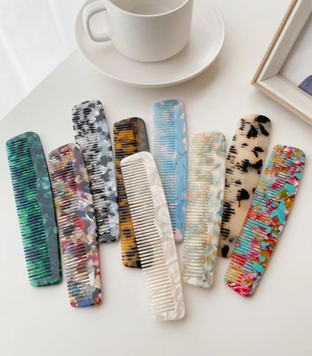 A collection of stylish and colorful acetate hair combs available for wholesale.