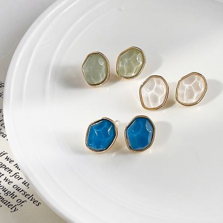 14K Gold Plated Resin Color Irregular Geometric Stud Earrings - A set of three pairs of 14K gold plated irregular geometric stud earrings in blue, white, and green resin, displayed together.