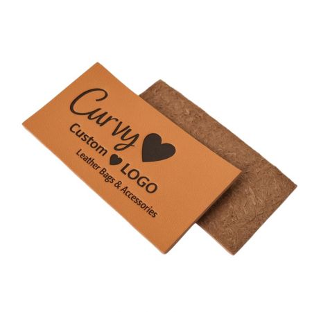 A custom-shaped leather tag with a logo, perfect as a bag accessory or brand identifier.