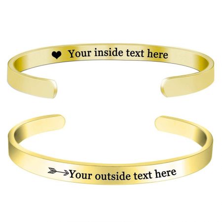 A luxurious gold-plated stainless steel bangle with precise custom engraving.