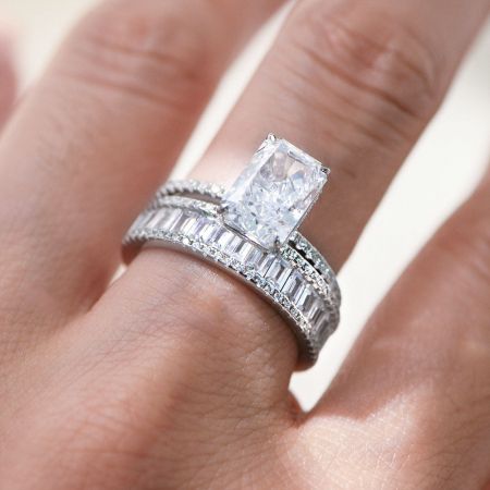 The complete 925 silver bridal set, showing the radiant-cut engagement ring stacked with the baguette eternity band.