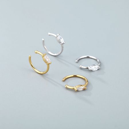 Close-up view of the sterling silver and gold-plated nose cuff clips, highlighting the clear gemstone details.
