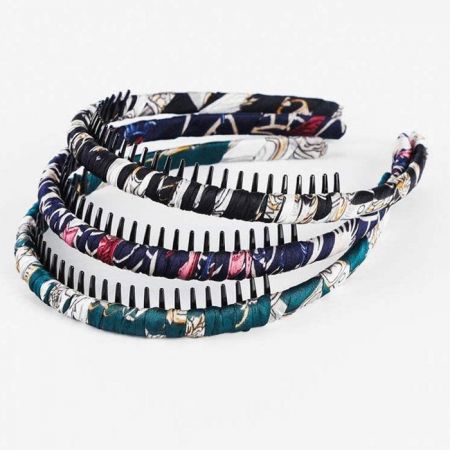 Fabric-Wrapped Hair Band with Resin Plastic Teeth - A collection of colorful fabric-wrapped hair bands with inner teeth for a secure hold, stacked to show different patterns.