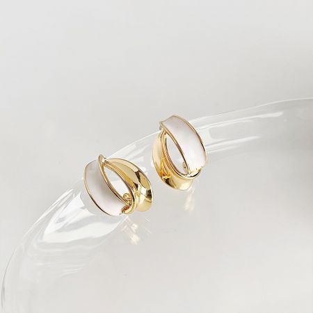 14k Gold Plated White Enamel Geometric Design Stud Earrings - A set of five 14k gold-plated stud earrings with white enamel geometric designs, elegantly displayed on a transparent stand.