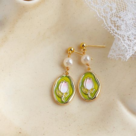 14k Gold Plated Enamel Tulip Flower with Pearl Drop Earrings - A set of five pairs of 14k gold-plated enamel tulip flower earrings with pearl drops, showcasing intricate green and pink details on a white background.