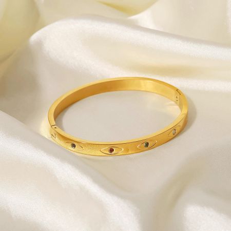 Detailed view of another evil eye bangle with vibrant colored gemstones.