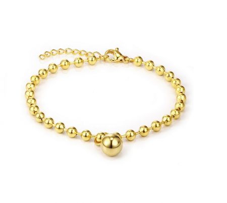 Gouden kraal roestvrijstalen armband - Een close-up van de gouden kraal roestvrijstalen armband (JRH-022) in een gouden afwerking, die zijn gepolijste kralen en centrale grotere kraal toont.