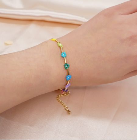 Styled shot of the Beaded Flower Bracelet, highlighting the colorful flower beads against a neutral background.