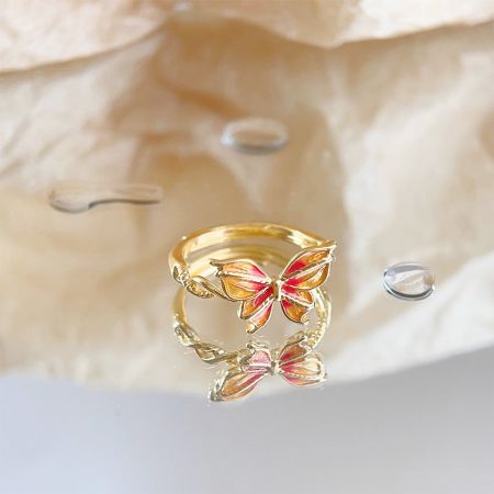 Full set of five gold-plated butterfly rings shown together.