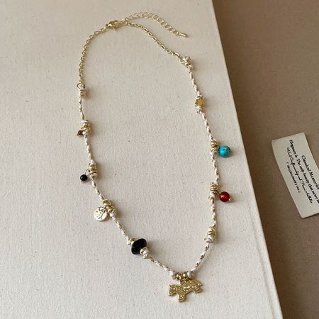 Full view of the bohemian rope necklace with its gold horse pendant, perfect for wholesale.