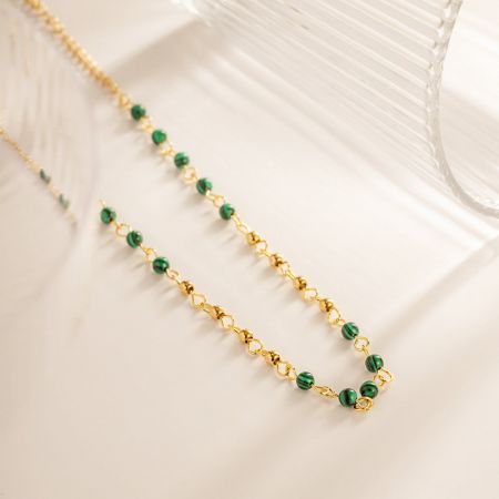 Another perspective of the layered stainless steel necklaces, showing their texture and shine.