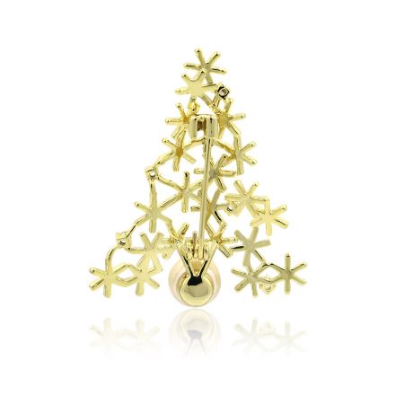 Side profile of the gold Christmas tree brooch showing its depth and craftsmanship.