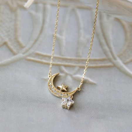 Close-up view of the celestial-themed pendant on the 925 silver necklace, showing the detailed star and moon design.