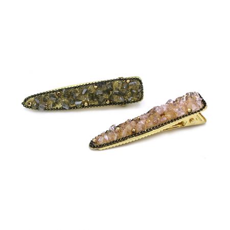 Ambas as opções de cor para os prendedores de cabelo de cristal dourado exibidas juntas.
