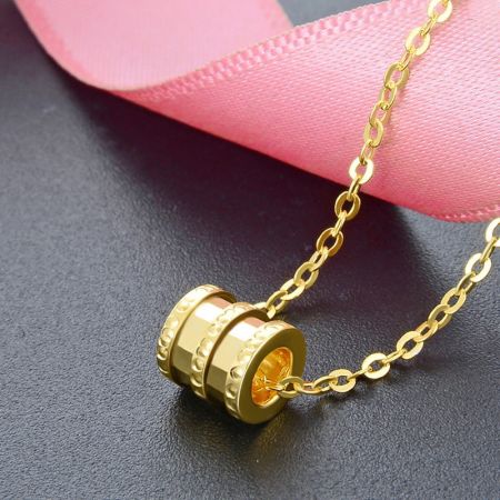 Detailed view of the gold-plated 925 sterling silver lucky tube bead necklace.
