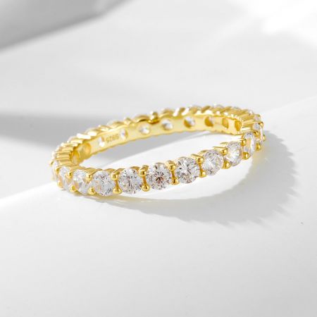 The complete 3-piece bridal ring set, including the oval cut CZ engagement ring and two matching eternity bands in gold-plated silver.