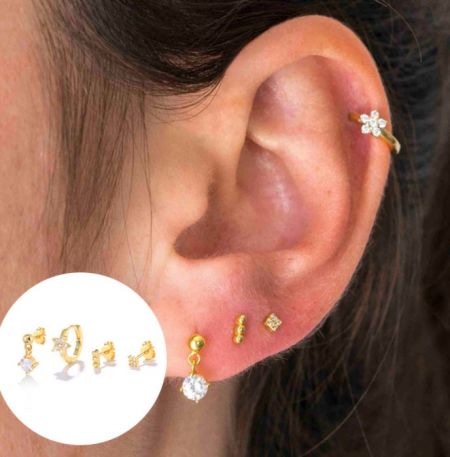 Modello che indossa il set di orecchini huggie a cerchio in zirconia cubica per mostrare stili diversi.