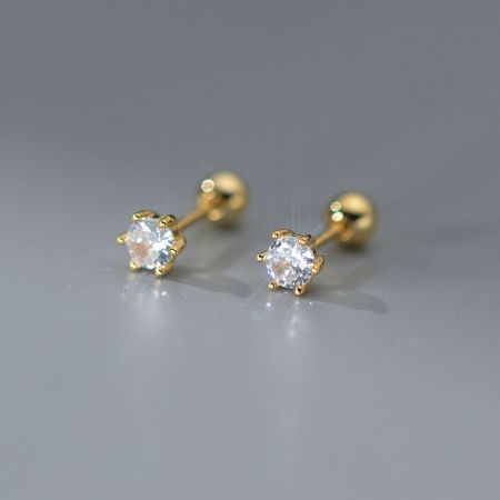 Close-up view of the gold-finished 925 silver stud earrings with a secure six-prong setting.