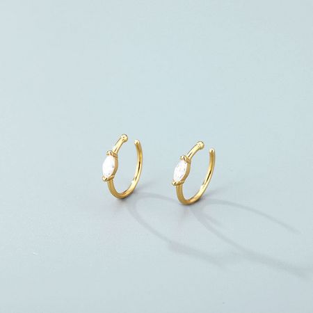 Detailed shot of the gold no-piercing nose cuff with a white gemstone, showcasing its fine craftsmanship.