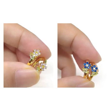 The versatile flower hoop earrings displayed with their interchangeable gemstone options.