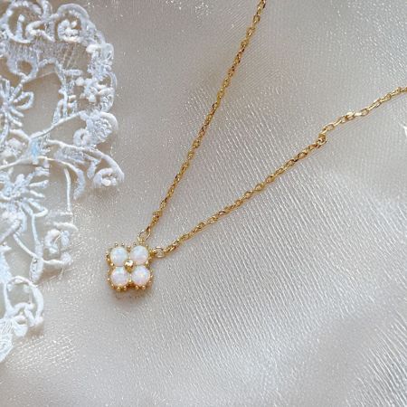 Another angle of the minimalist clover opal necklace, highlighting its delicate design.