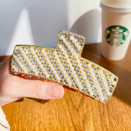 Detailed view of the gold-pearl variant, highlighting the intricate combination of faux pearls and rhinestones.