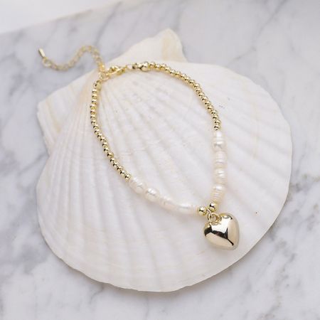 Detailed view of the Valentine Heart Pendant Pearl Bracelet on a white background.