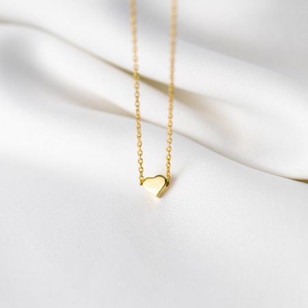 Detailed view of the gold 925 sterling silver heart pendant necklace.