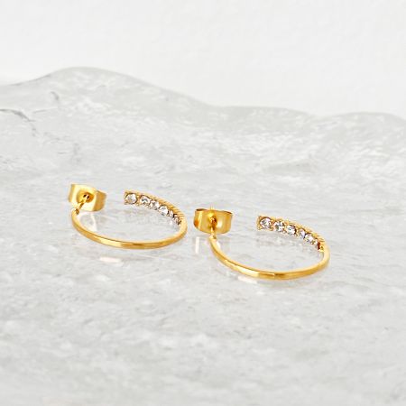 Another angle of the stainless steel zirconia hoop earrings, highlighting their brilliant shine.