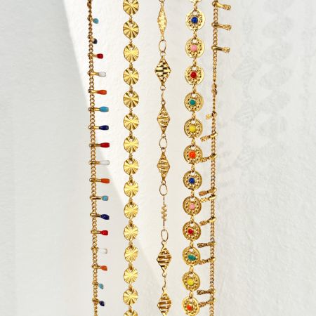 A collection of the Bohomia belly chains in a radiant gold finish, displayed to show various styles.