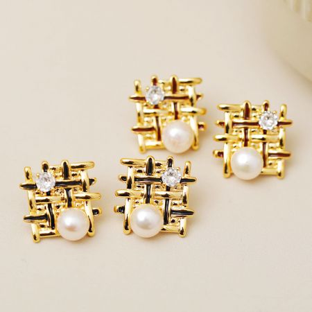 Braided Mesh Pearls Enamel Color Stud Earrings - A close-up of the Braided Mesh Pearl Enamel Stud Earrings, showcasing the intricate gold lattice design with a central pearl and a sparkling clear gemstone.
