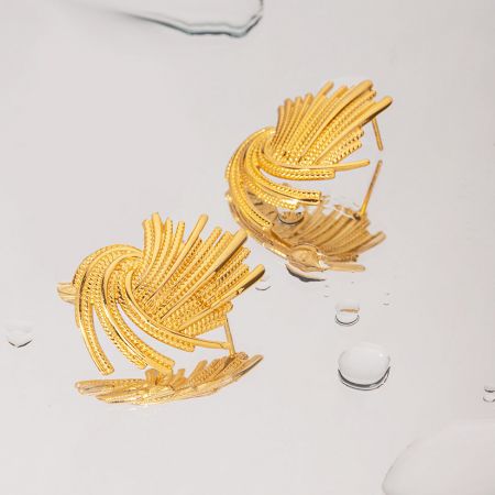 Another design from the five-pair set, featuring a delicate leaf or feather shape.