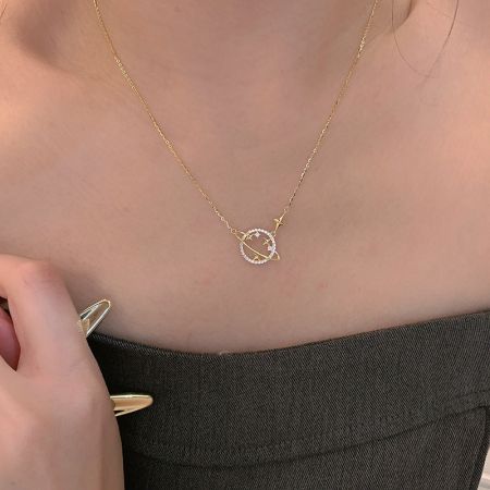 Another angle of the planetary pendant necklace, showing the intricate stone details.