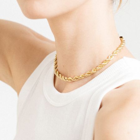 Clear product shot of the gold twisted rope necklace against a neutral background.