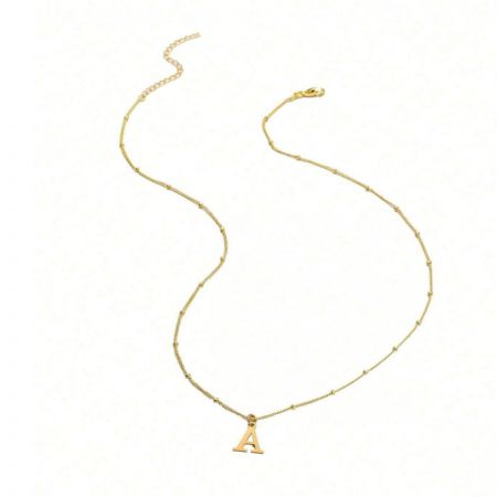 The minimalist necklace featuring a gold 'A' initial pendant.