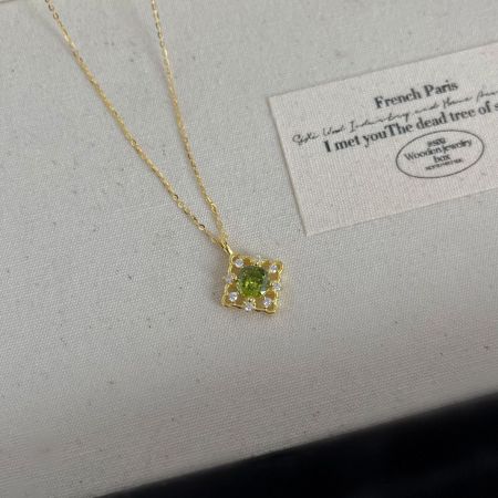 A different angle of the 925 sterling silver necklace, highlighting its radiant 14K gold plating.