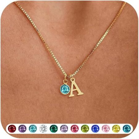 The alphabet necklace featuring the letter 'A' paired with a brilliant blue gemstone.