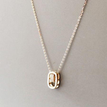 Close-up shot of the pendant's texture and the surrounding cubic zirconia.