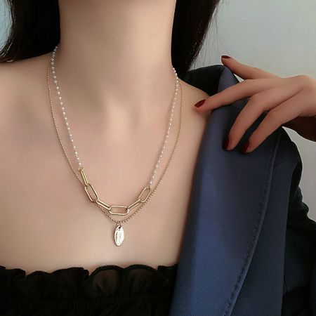 Another angle of the White Pearl Strand Necklace, showing the clasp and extension chain.
