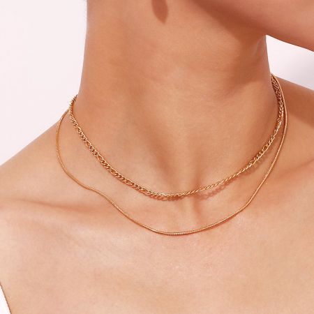 Model wearing the double layered stainless steel Figaro necklace set.